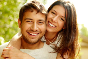 Dental Patients Smiling With Well Cared For Dental Implants In Palm Harbor, FL