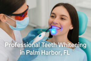 A woman in a dental chair is smiling as a dentist uses a curing light on her teeth after a teeth whitening treatment. The dentist is wearing protective glasses and a mask. The text on the image says "Professional Teeth Whitening in Palm Harbor, FL".